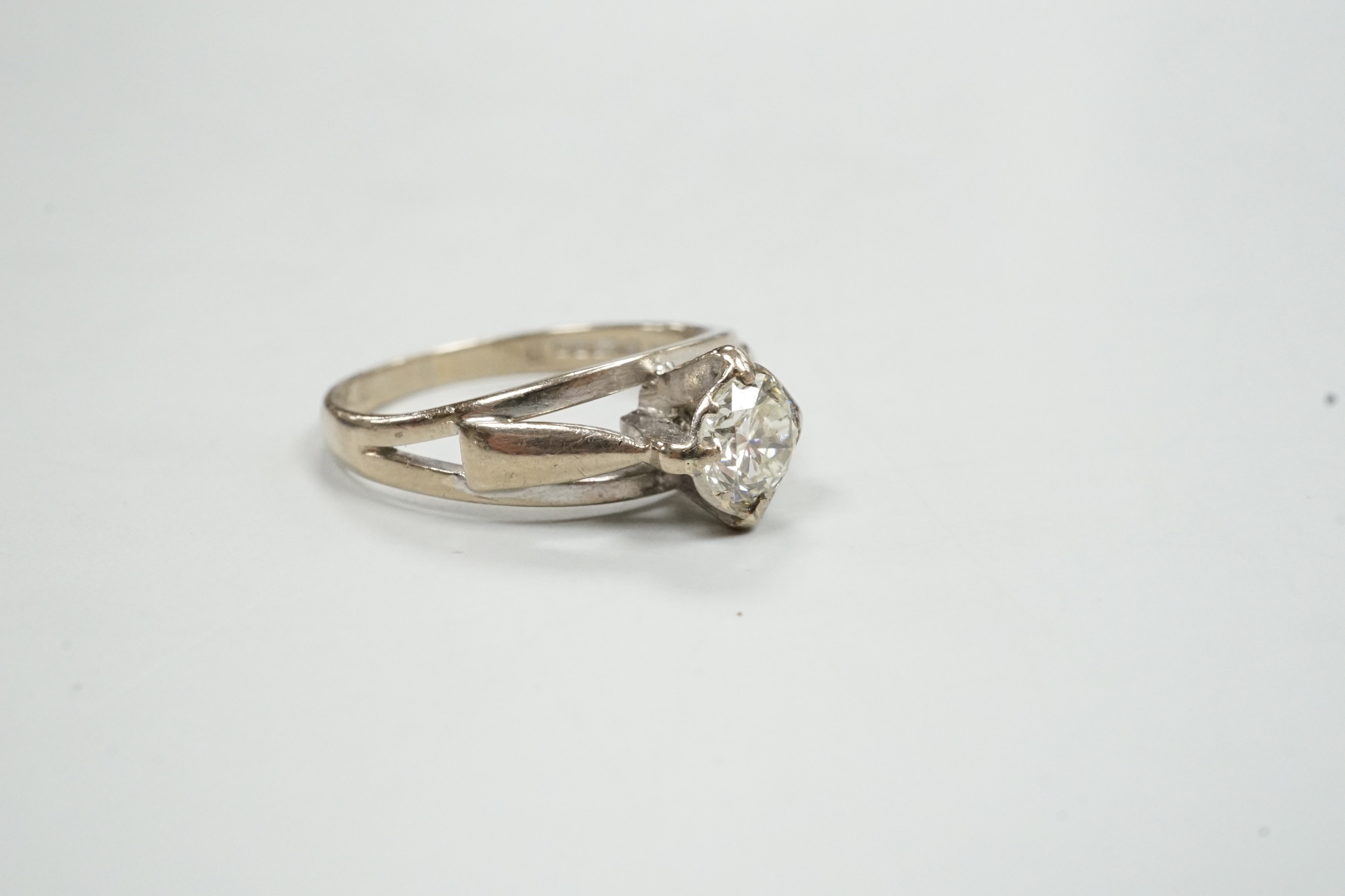 A modern 18ct white gold and solitaire diamond ring, size N, gross weight 3.7 grams.